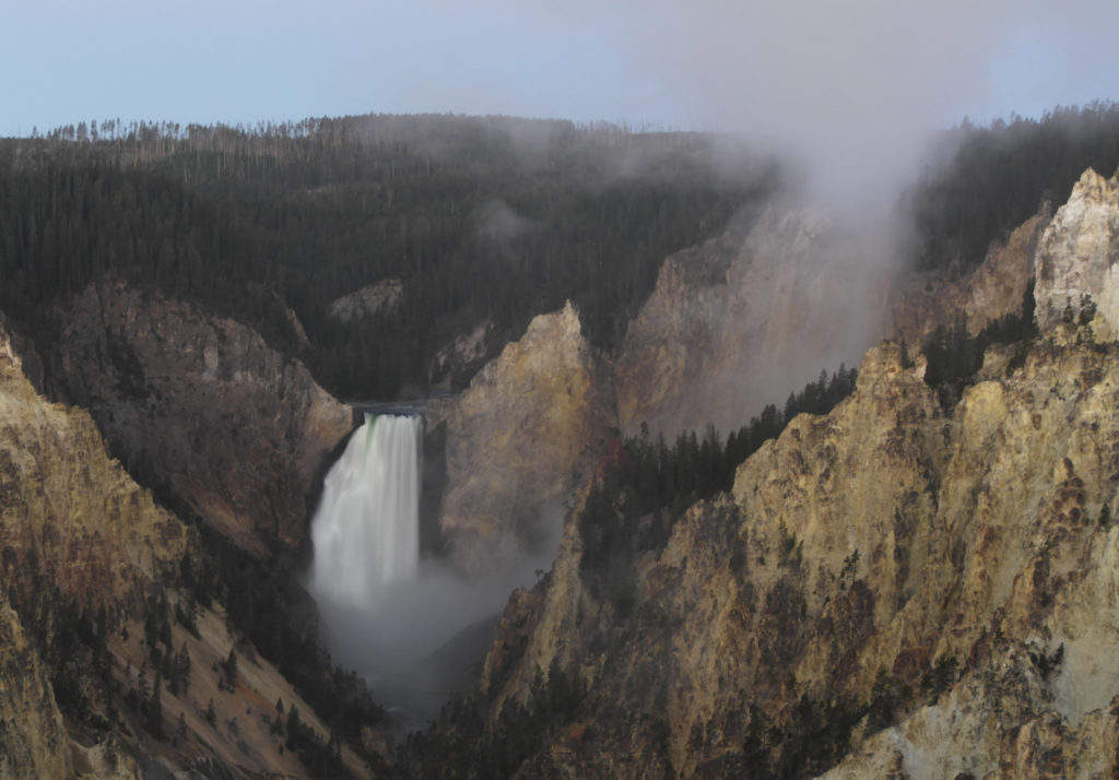 Lower falls of the Yellowstone river in the Grand Canyon of the Yellowstone. Tip: Planning your trip to arrive early is key to avoiding crowds.